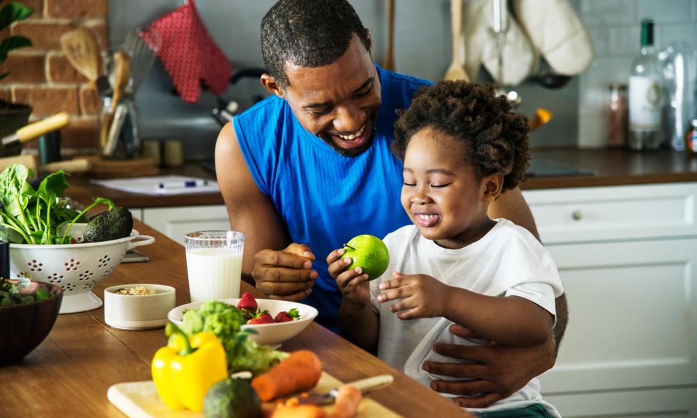 Father and child with healthy food
