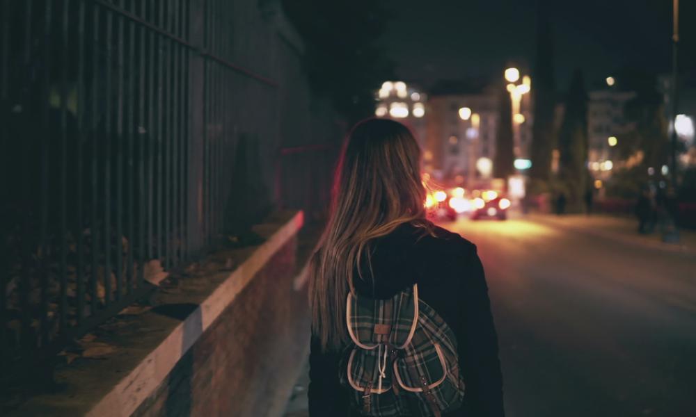 Girl alone in street at night