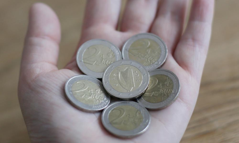 Euro coins in hand