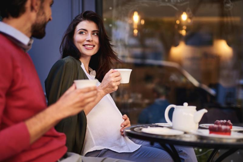 Pregnant lady drinking coffee
