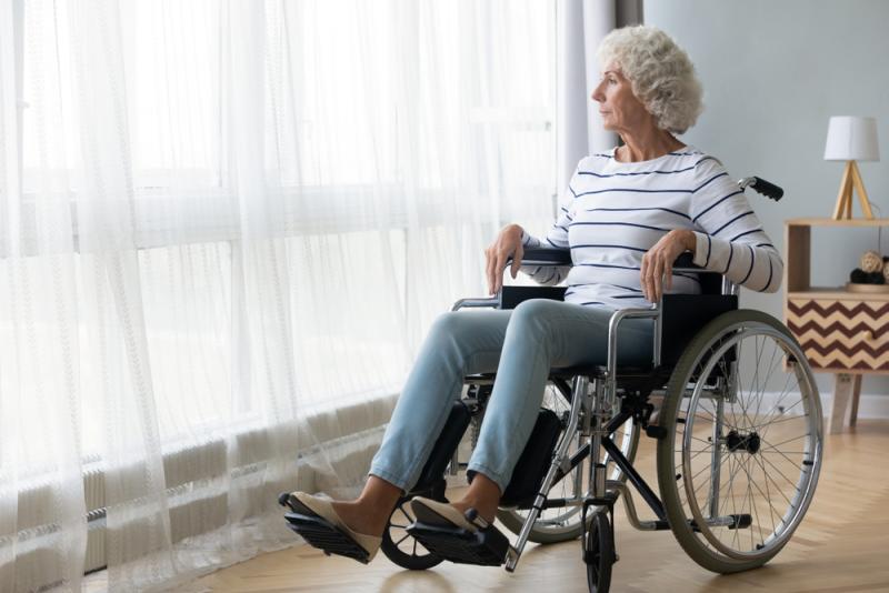 Older lady in wheelchair at wondow