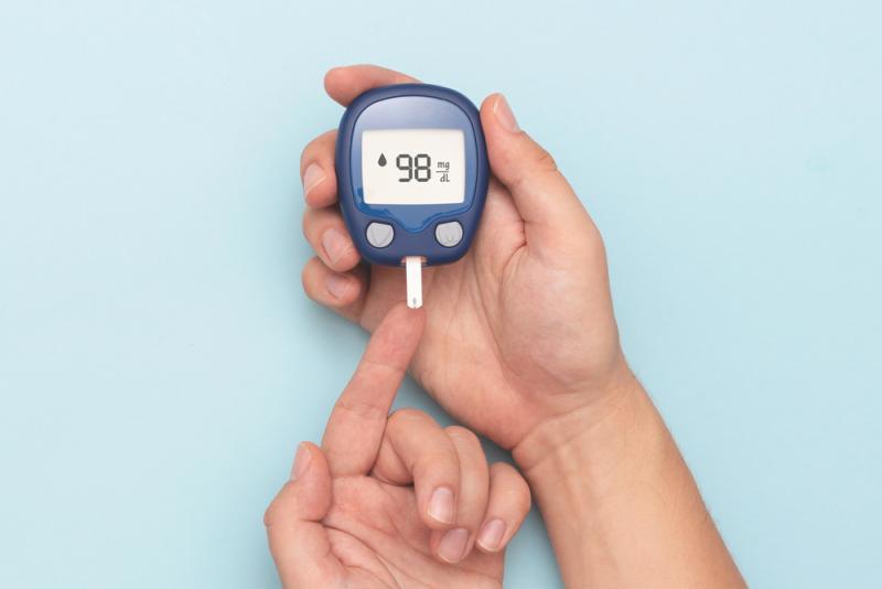 Person testing blood sugar levels